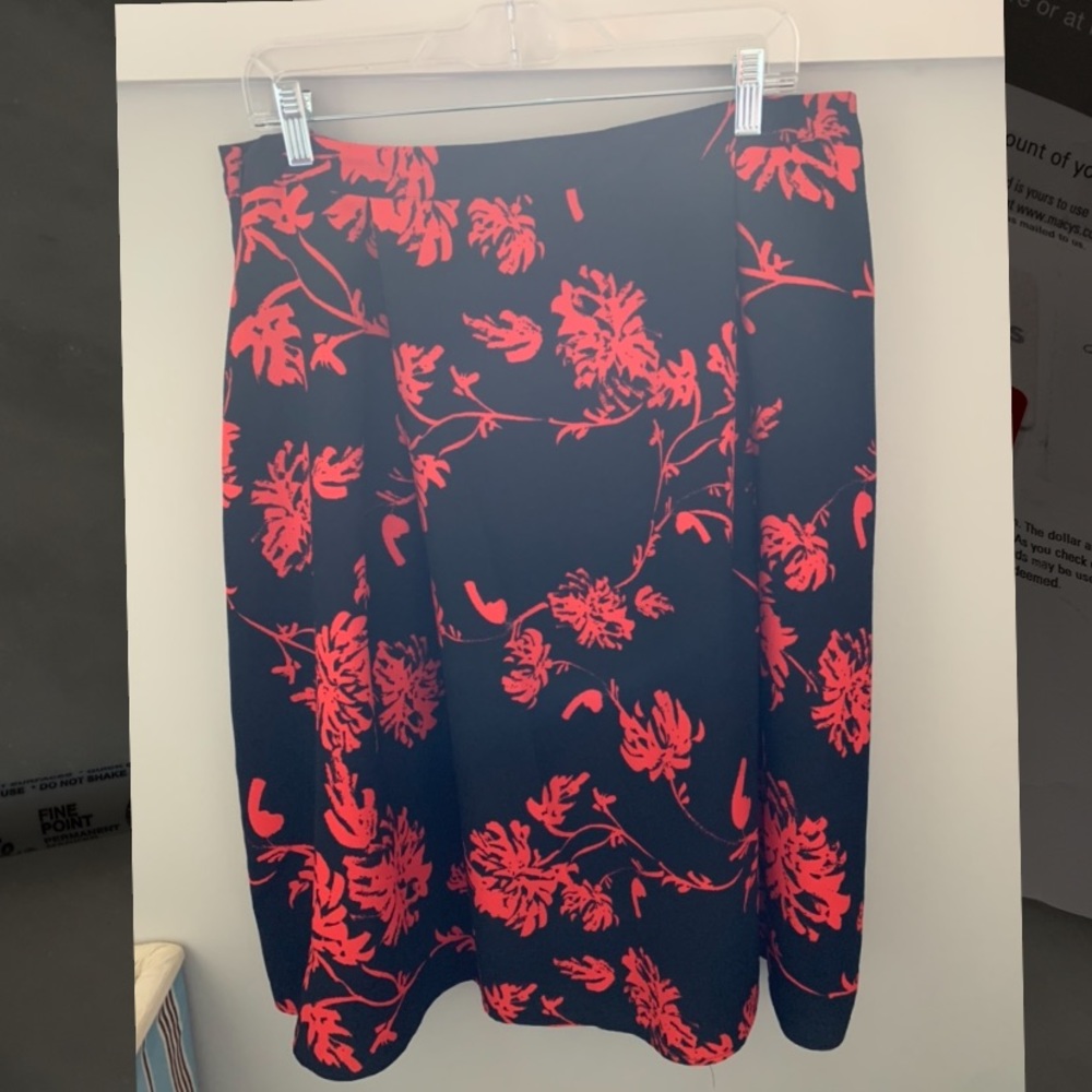 Black skirt with red flowers, size 14.